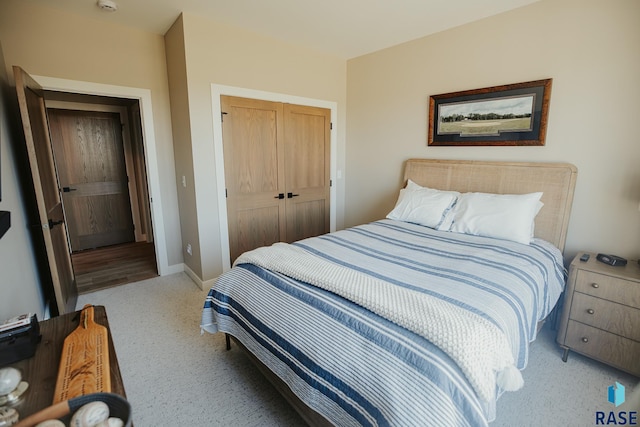 carpeted bedroom with a closet