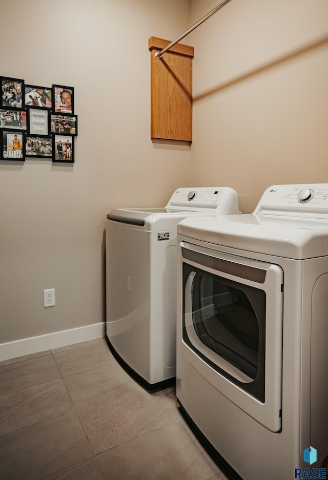 washroom with washer and dryer