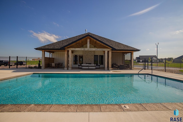 view of swimming pool featuring a patio and outdoor lounge area