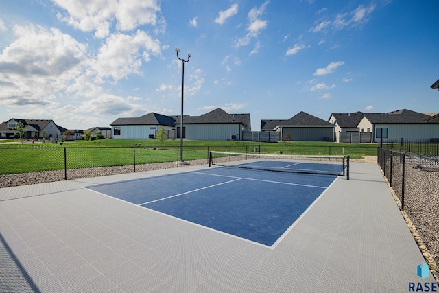 view of tennis court featuring basketball hoop