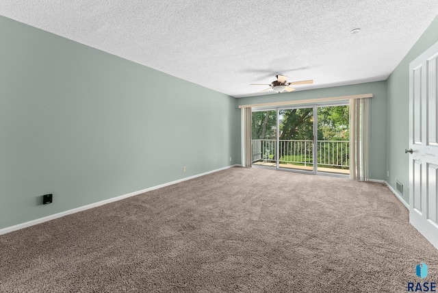 carpeted empty room with a textured ceiling and ceiling fan