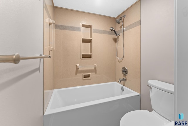 bathroom featuring toilet and bathtub / shower combination