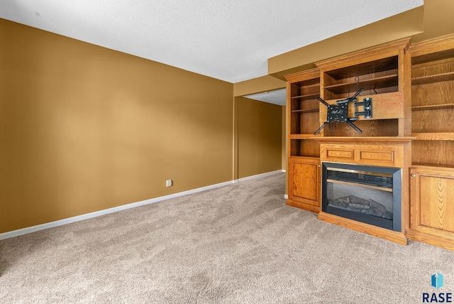 unfurnished living room featuring light colored carpet