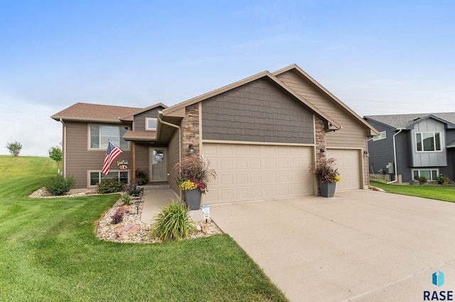 view of front of home with a garage and a front lawn