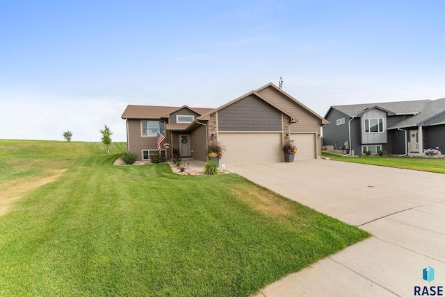 view of front facade with a front yard and a garage