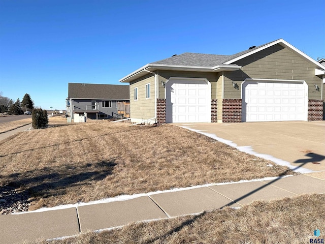 ranch-style house featuring a garage