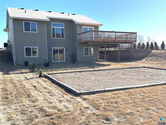 rear view of house with a deck and cooling unit