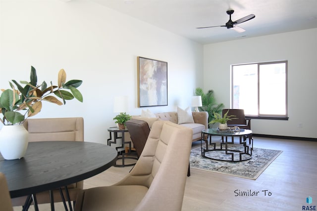 living room with hardwood / wood-style flooring and ceiling fan