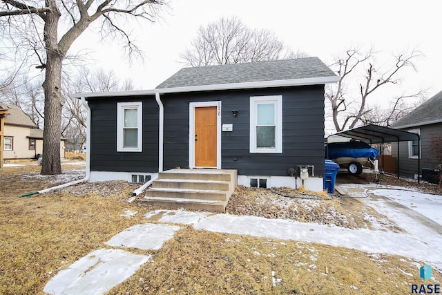 bungalow-style house with a carport