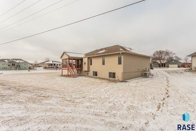 back of property with central AC