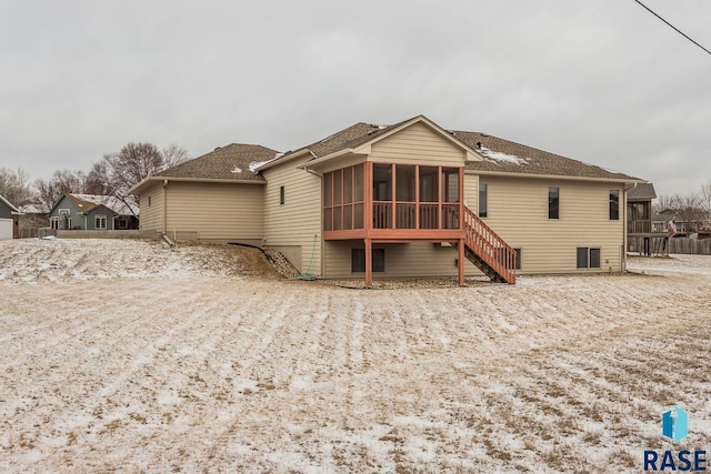 back of house featuring a sunroom