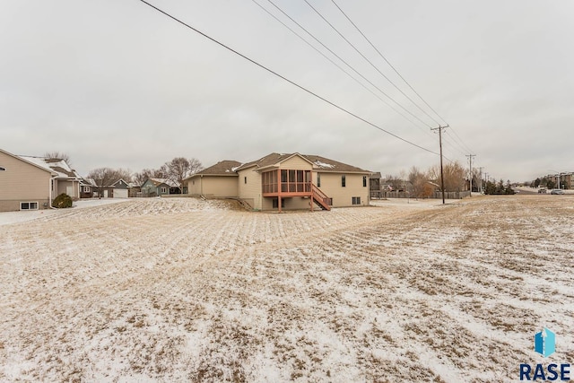 back of property with a sunroom