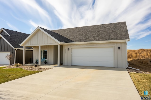 view of front of home featuring a porch and a garage