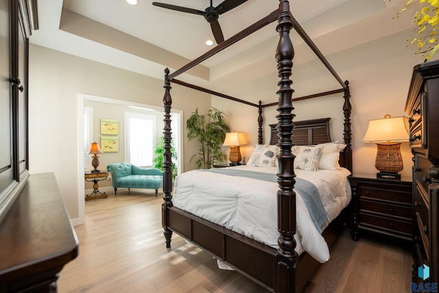 bedroom featuring hardwood / wood-style floors and ceiling fan