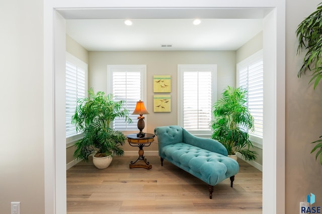 sitting room with light hardwood / wood-style floors and a wealth of natural light