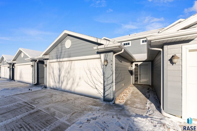 view of side of home featuring a garage