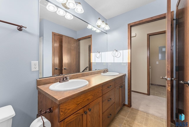 bathroom with toilet and vanity