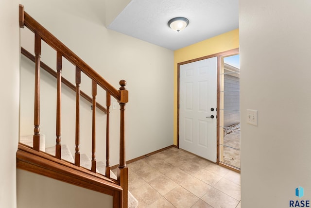 view of tiled foyer entrance