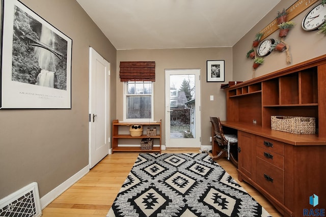 office space with light wood-type flooring