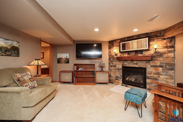 carpeted living room with a fireplace