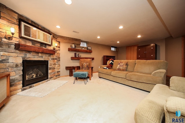 living room featuring light carpet and a stone fireplace