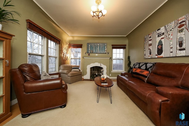 carpeted living room featuring crown molding, a healthy amount of sunlight, and a notable chandelier