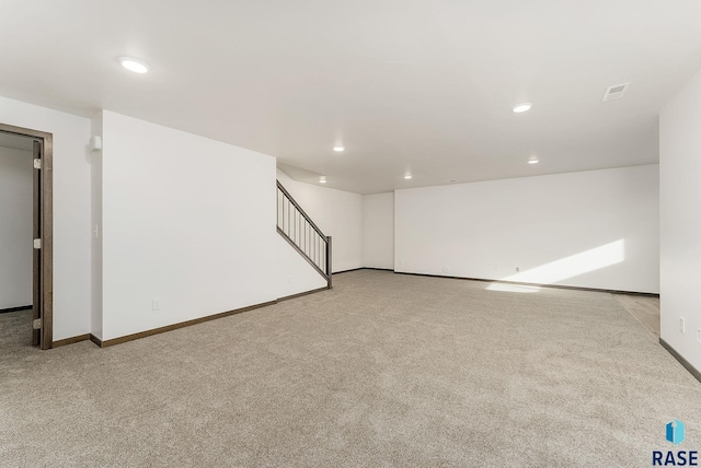 empty room featuring light colored carpet