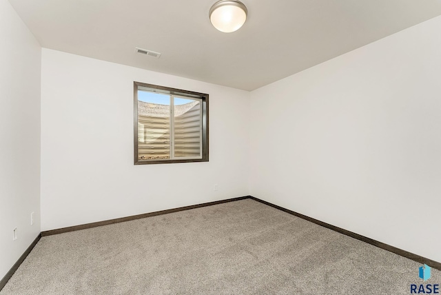 unfurnished room featuring carpet flooring