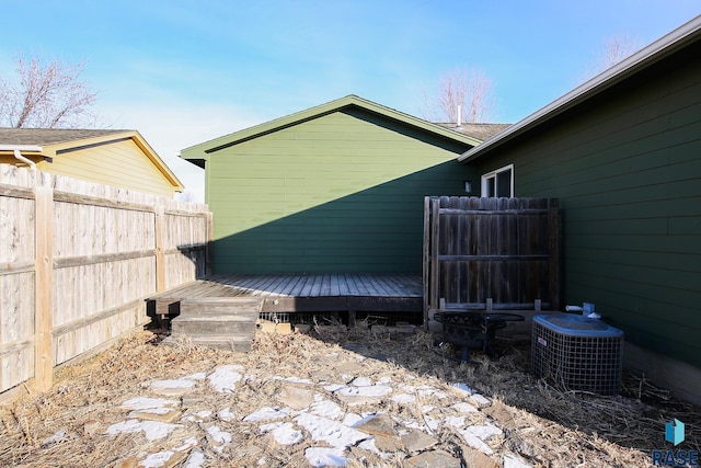 exterior space featuring central AC and a wooden deck