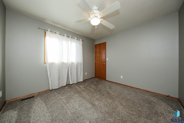 unfurnished room featuring carpet floors and ceiling fan