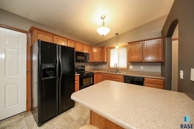 kitchen featuring black appliances, light tile patterned flooring, lofted ceiling, pendant lighting, and sink