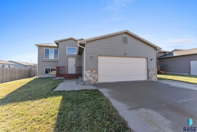 view of front of house with a front lawn and a garage