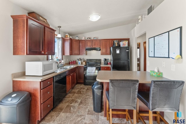 kitchen featuring vaulted ceiling, pendant lighting, black appliances, sink, and a breakfast bar area