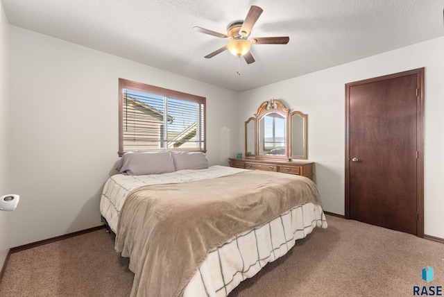 bedroom with ceiling fan and carpet