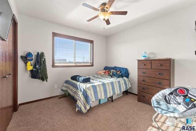 carpeted bedroom with ceiling fan