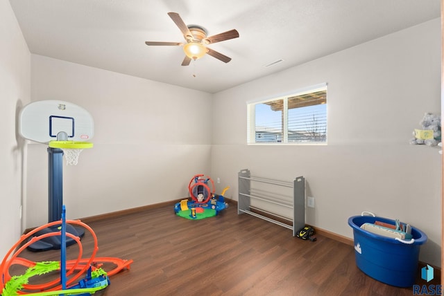 rec room featuring ceiling fan and dark hardwood / wood-style floors