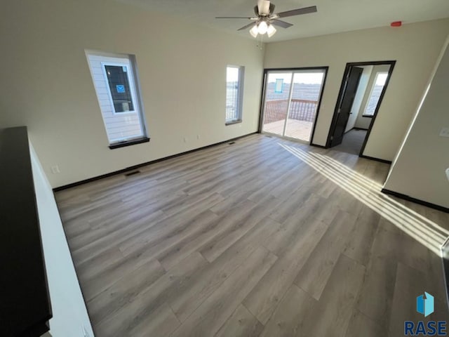 interior space featuring ceiling fan and light wood-type flooring