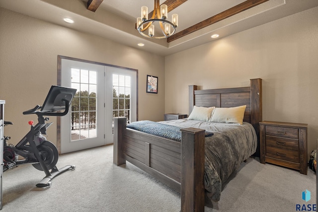 carpeted bedroom featuring a tray ceiling, access to exterior, beam ceiling, and a chandelier