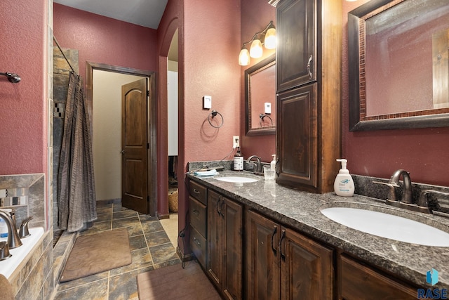 bathroom with vanity and plus walk in shower