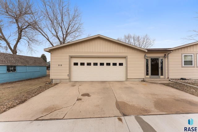 ranch-style home featuring a garage