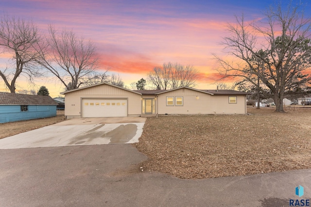 ranch-style home featuring a garage