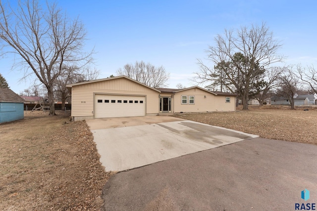 ranch-style home featuring a garage