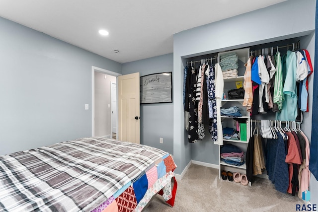 bedroom featuring carpet floors and a closet