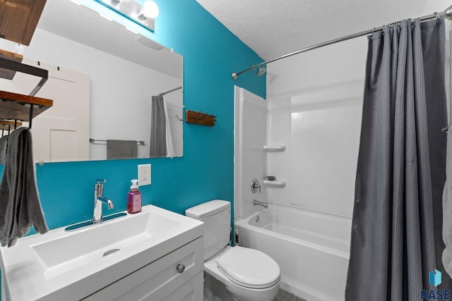 full bathroom with a textured ceiling, toilet, shower / bath combo, and vanity