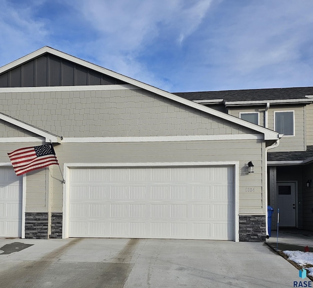 view of side of property featuring a garage