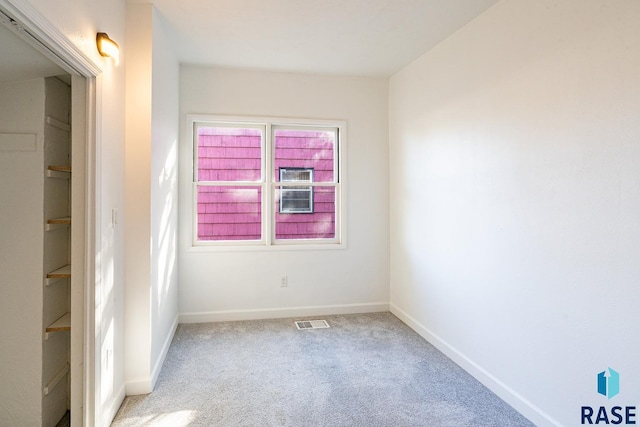 spare room with light colored carpet