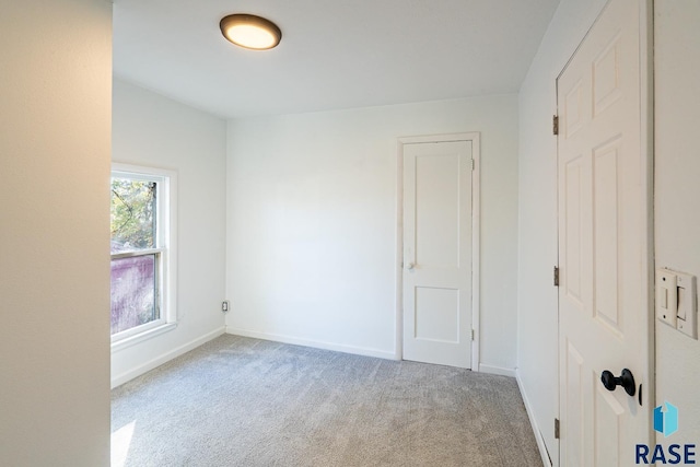 unfurnished bedroom with light carpet