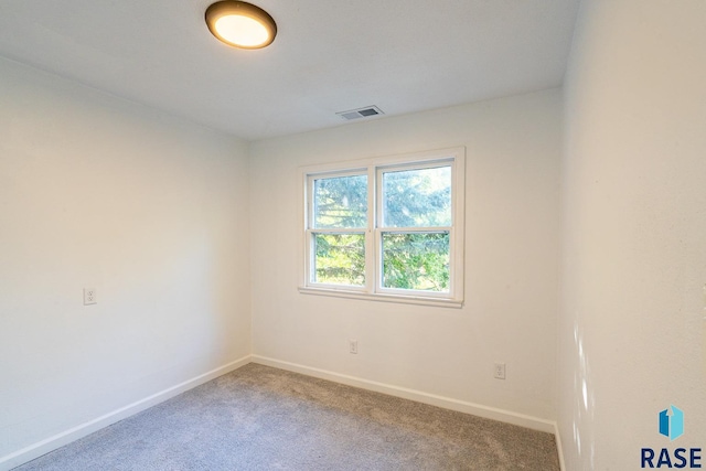 empty room with carpet flooring