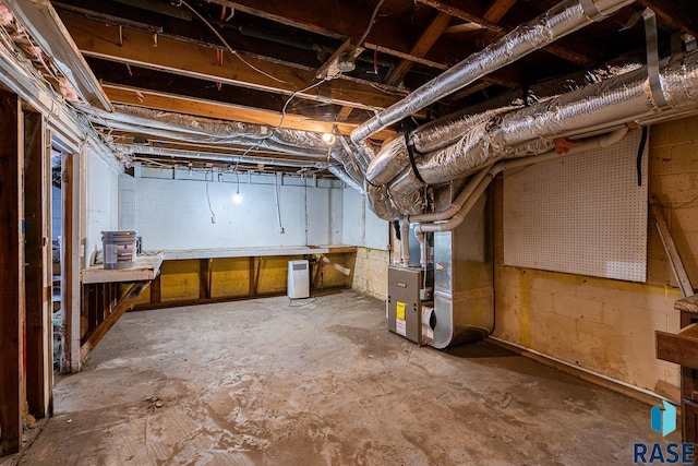 basement featuring heating unit