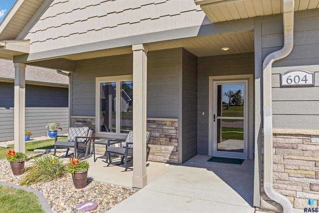 property entrance featuring a patio area